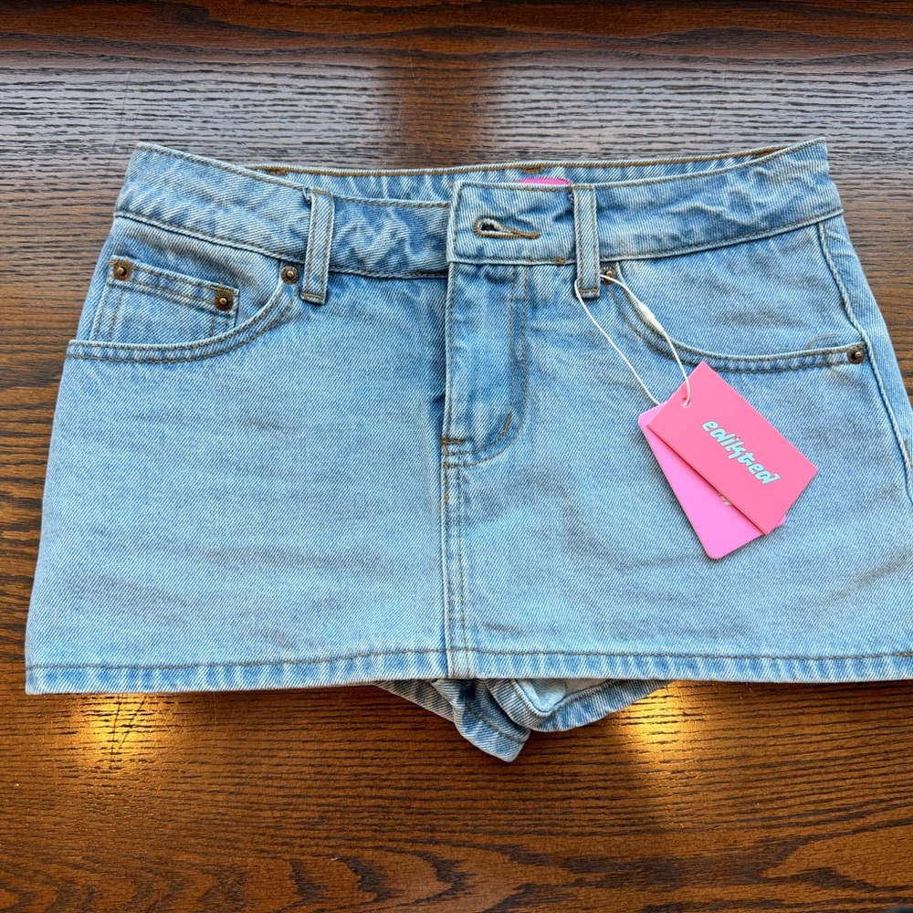Edikted Light Wash Denim Skort with Hot Pink Tag